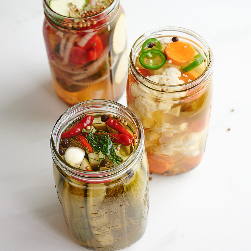 three jars of homemade pickled vegetables